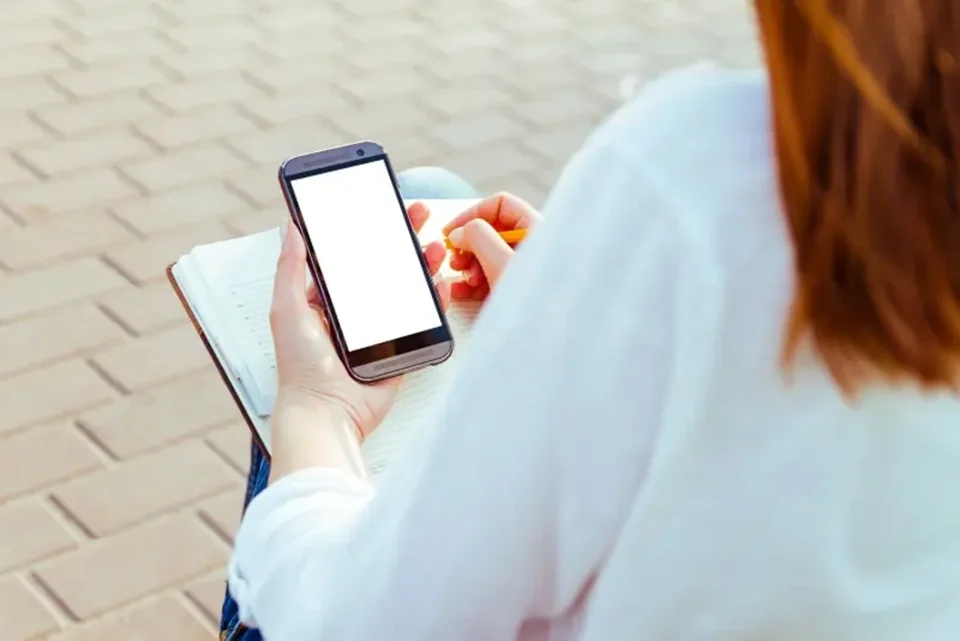 Customer using a phone to send details for an auto glass quote