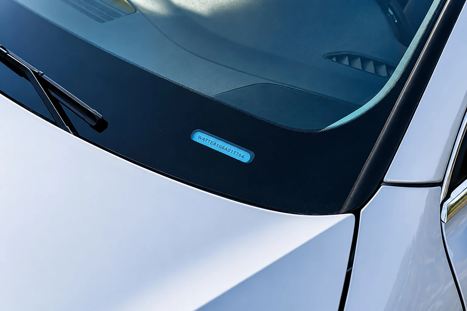 Windshield identification marking used to verify the correct replacement glass