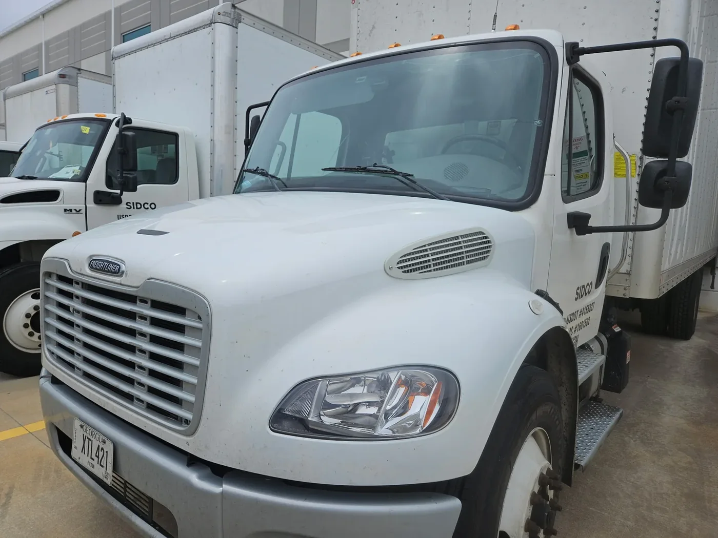 Commercial truck with windshield service completed at a mobile service location