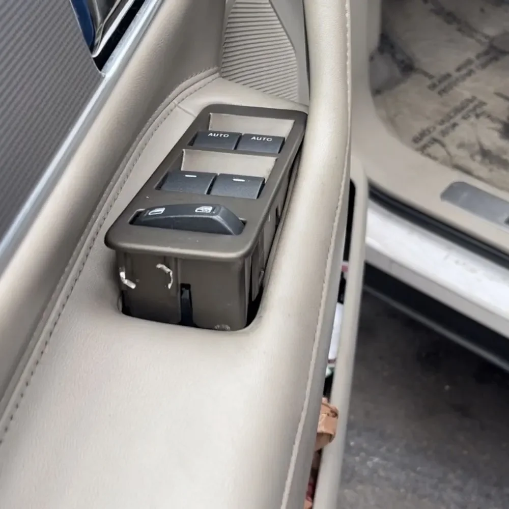 Vehicle power window switch panel inside a door