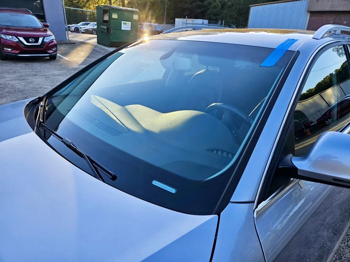 Vehicle windshield after auto glass service